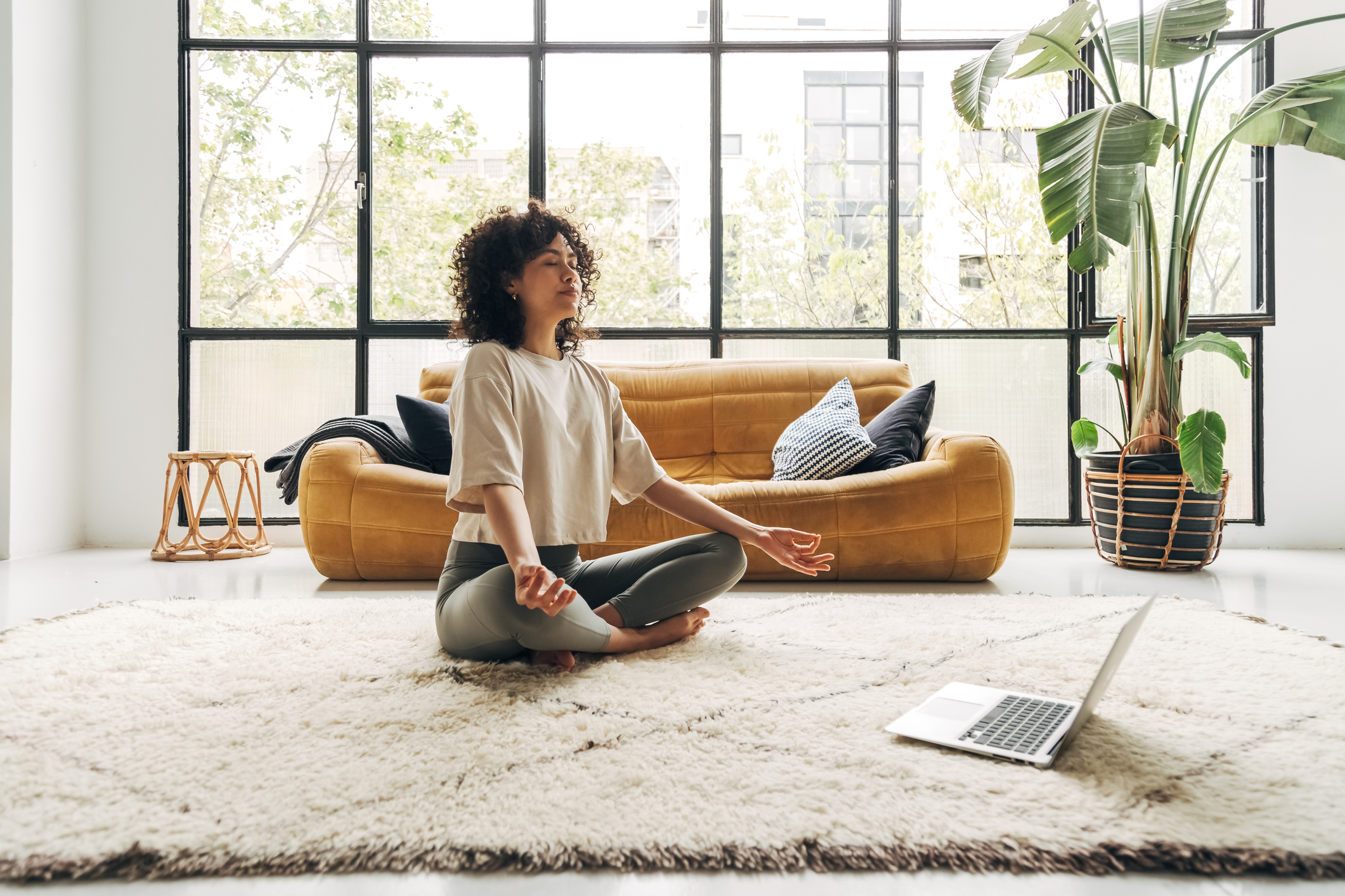 A Women Meditating by her computer