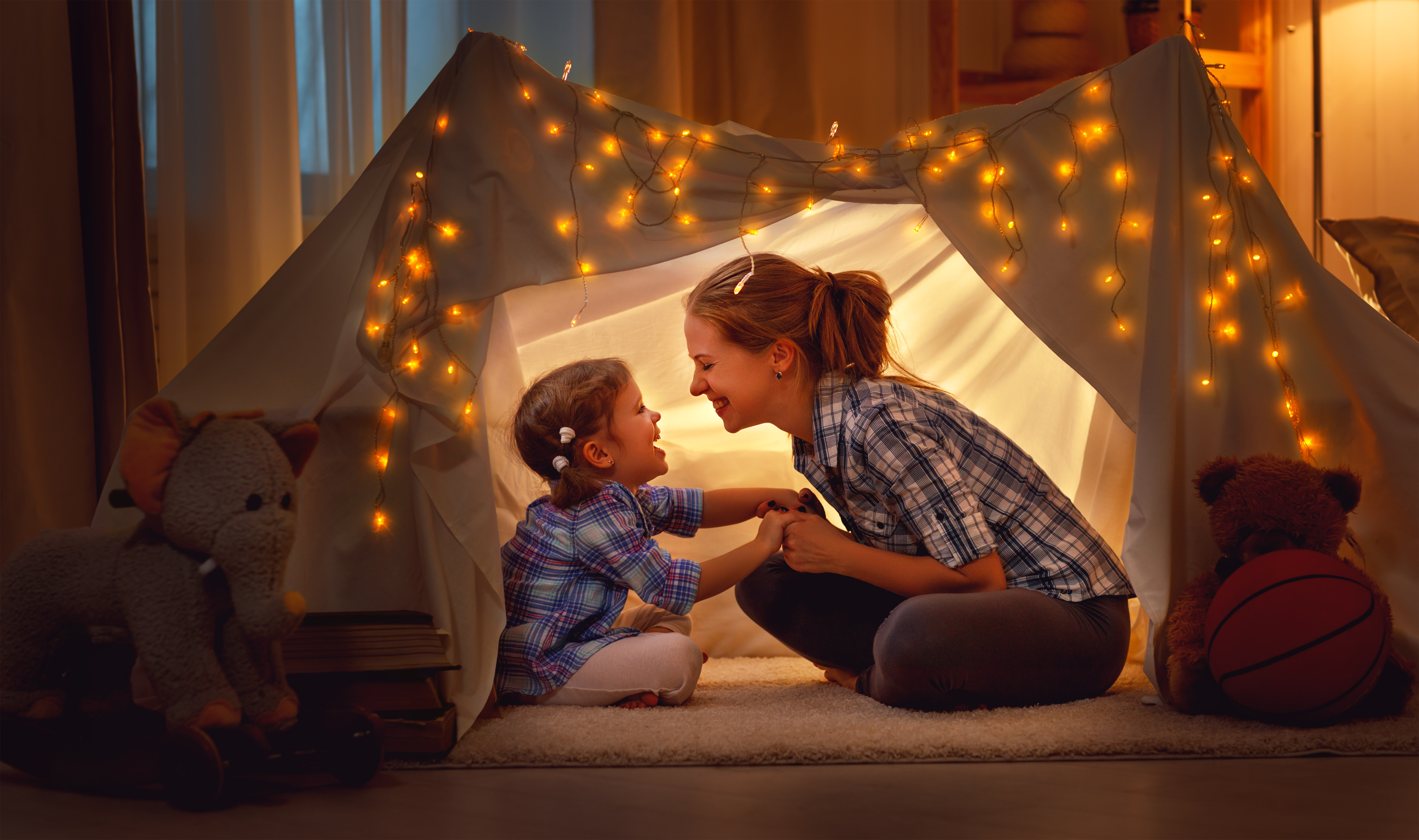 Mother and Daughter in a tent with lights