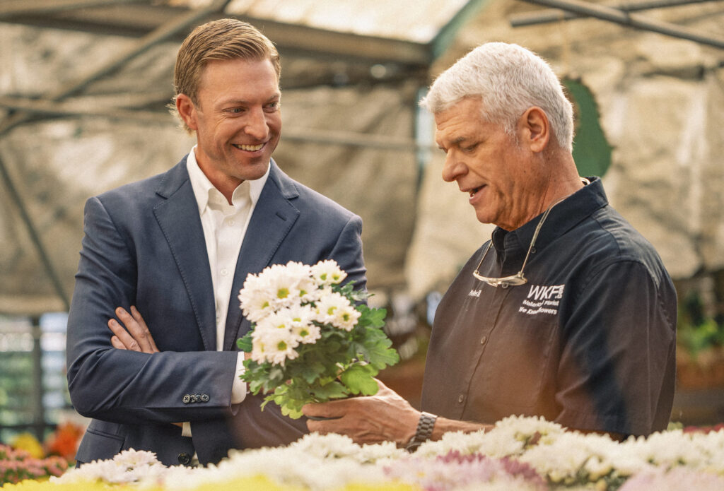 Eric Whitford, Midwest BankCentre, and Walter Knoll III, Walter Knoll Florist talking about business banking services